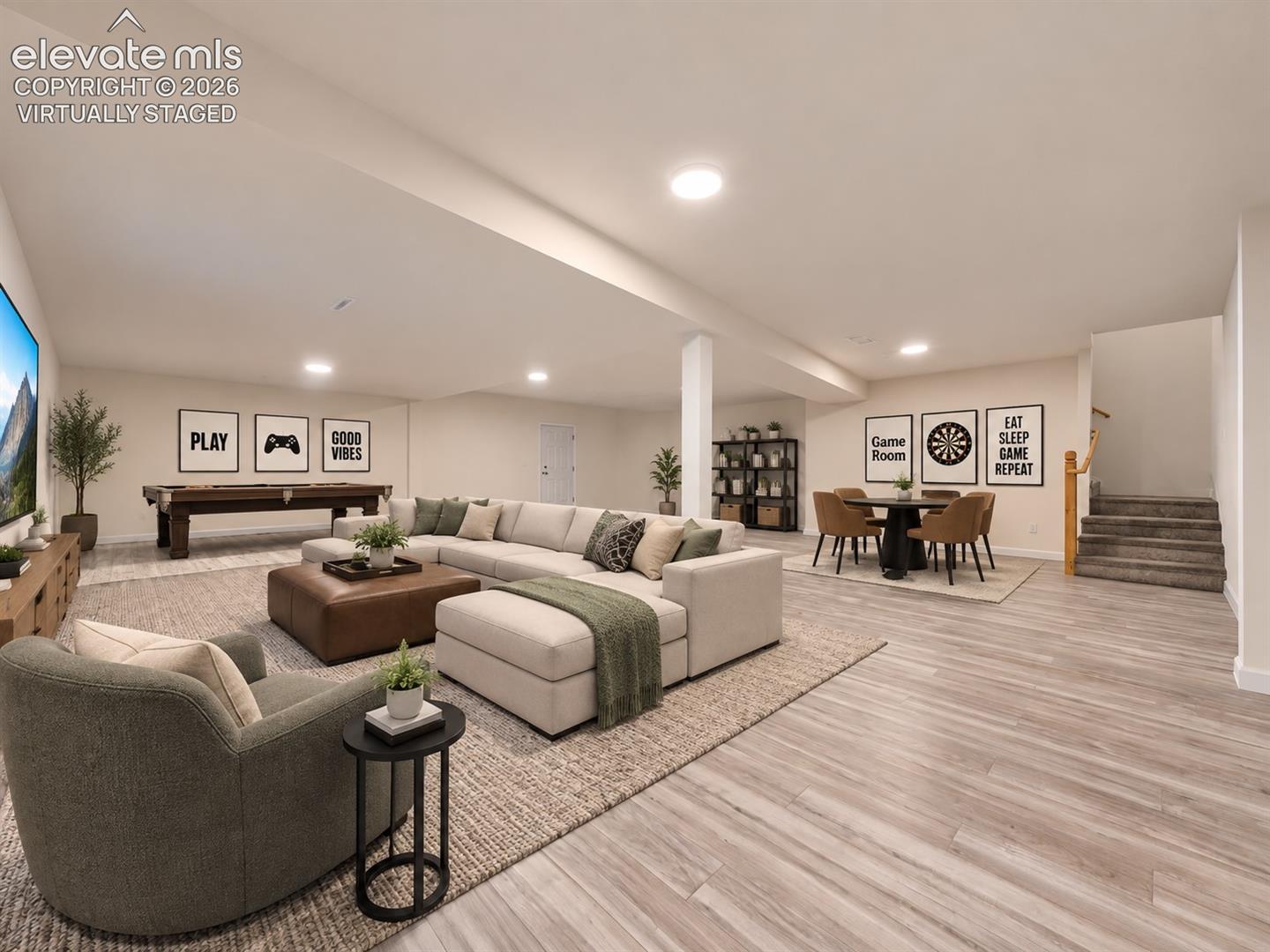 Virtually Staged Basement – Virtually staged as an inviting entertainment retreat with defined areas for movie watching, games, and gathering while preserving the basement’s spacious, open feel. Virtually staged.
