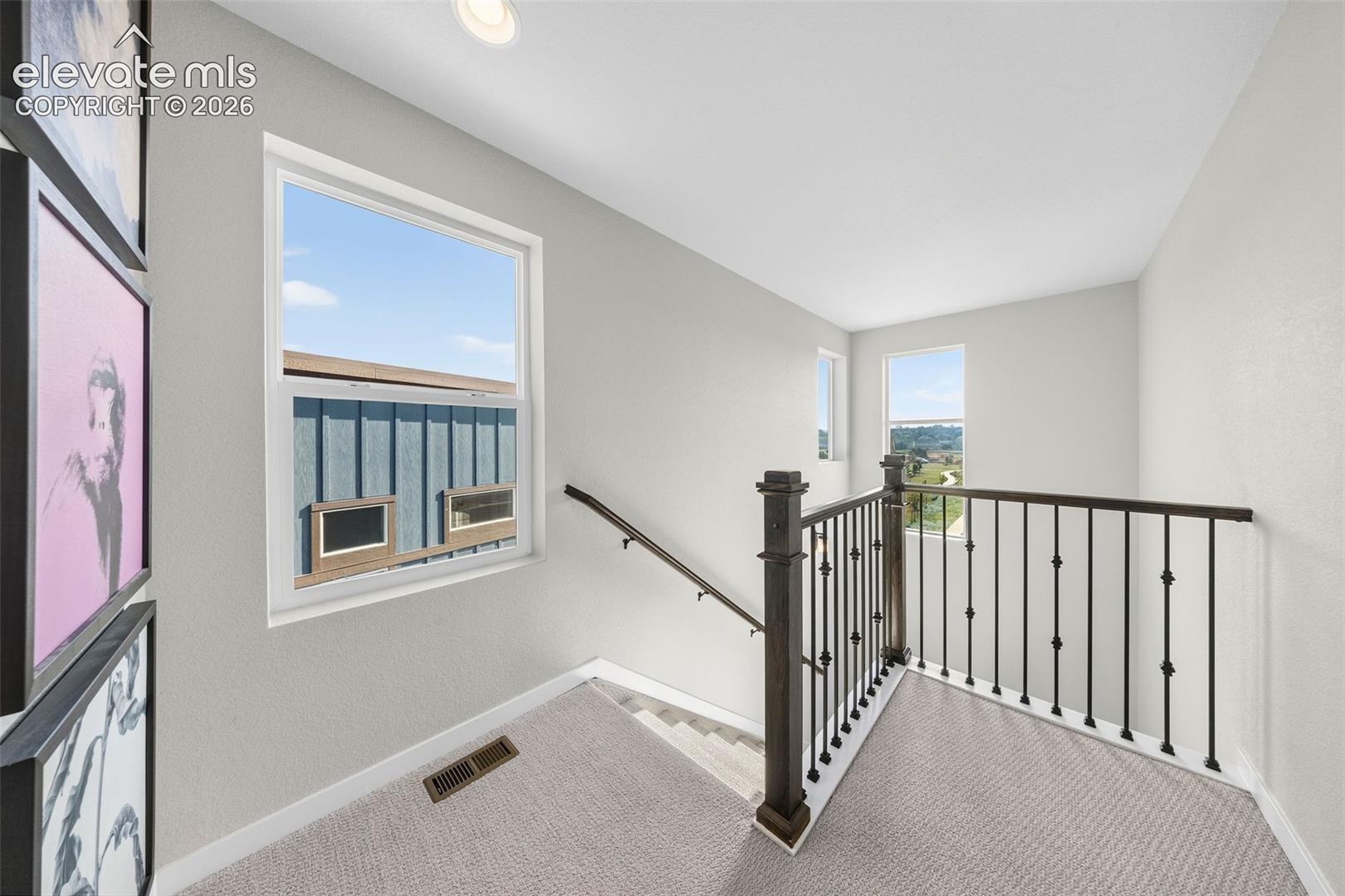 Abundant windows keep the stairwell bright and allow views of the park just outside. 
