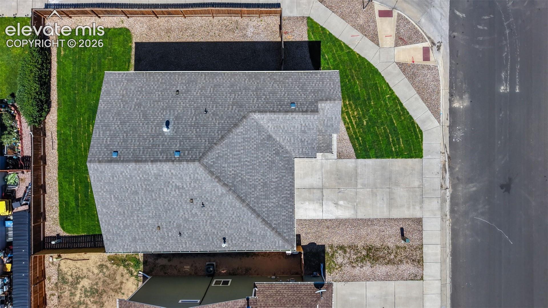 Asphalt shingle roof with multiple dormers, vent pipe, and skylights