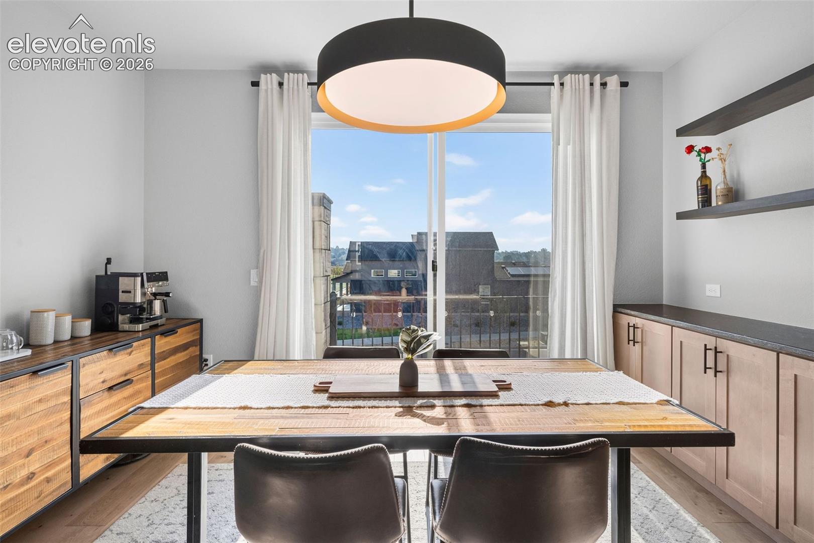 The spacious dining area has plenty of room for all your guests plus a coffee station, console/buffet, or whatever else you'd like to complement your experience. Extended cabinetry offers additional built-in storage and serving space. 