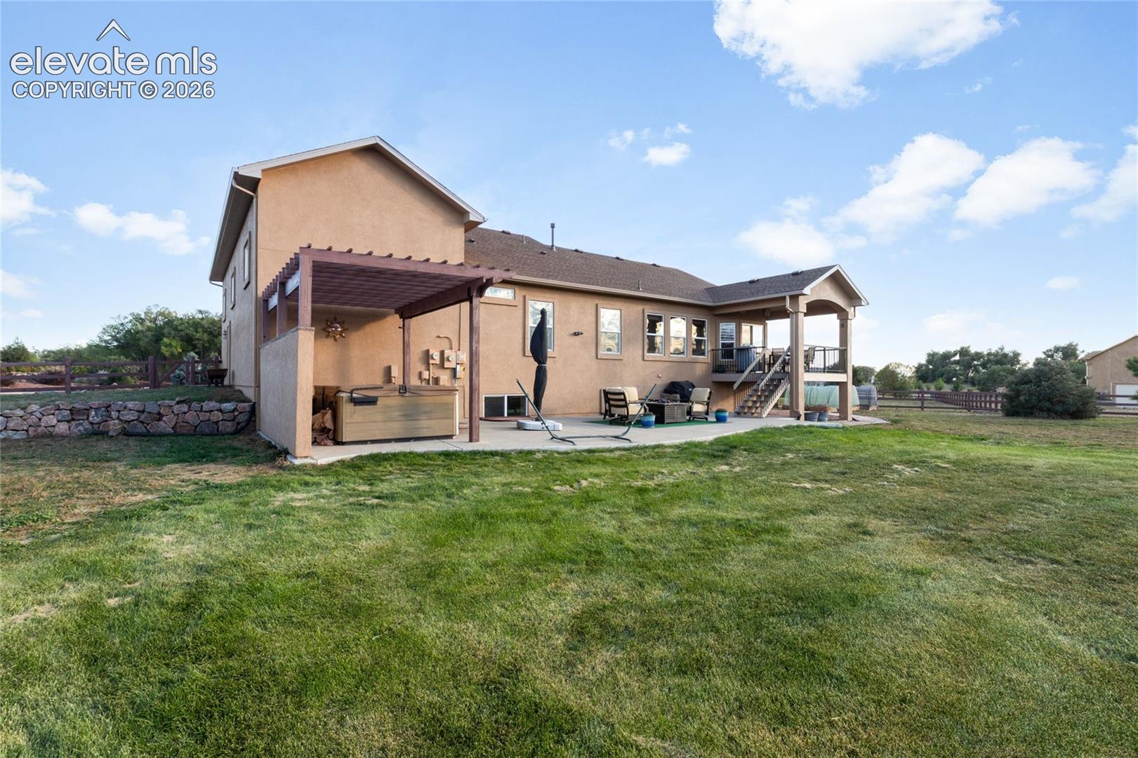 Back yard, patio, deck off the breakfast area, hot tub with pergola