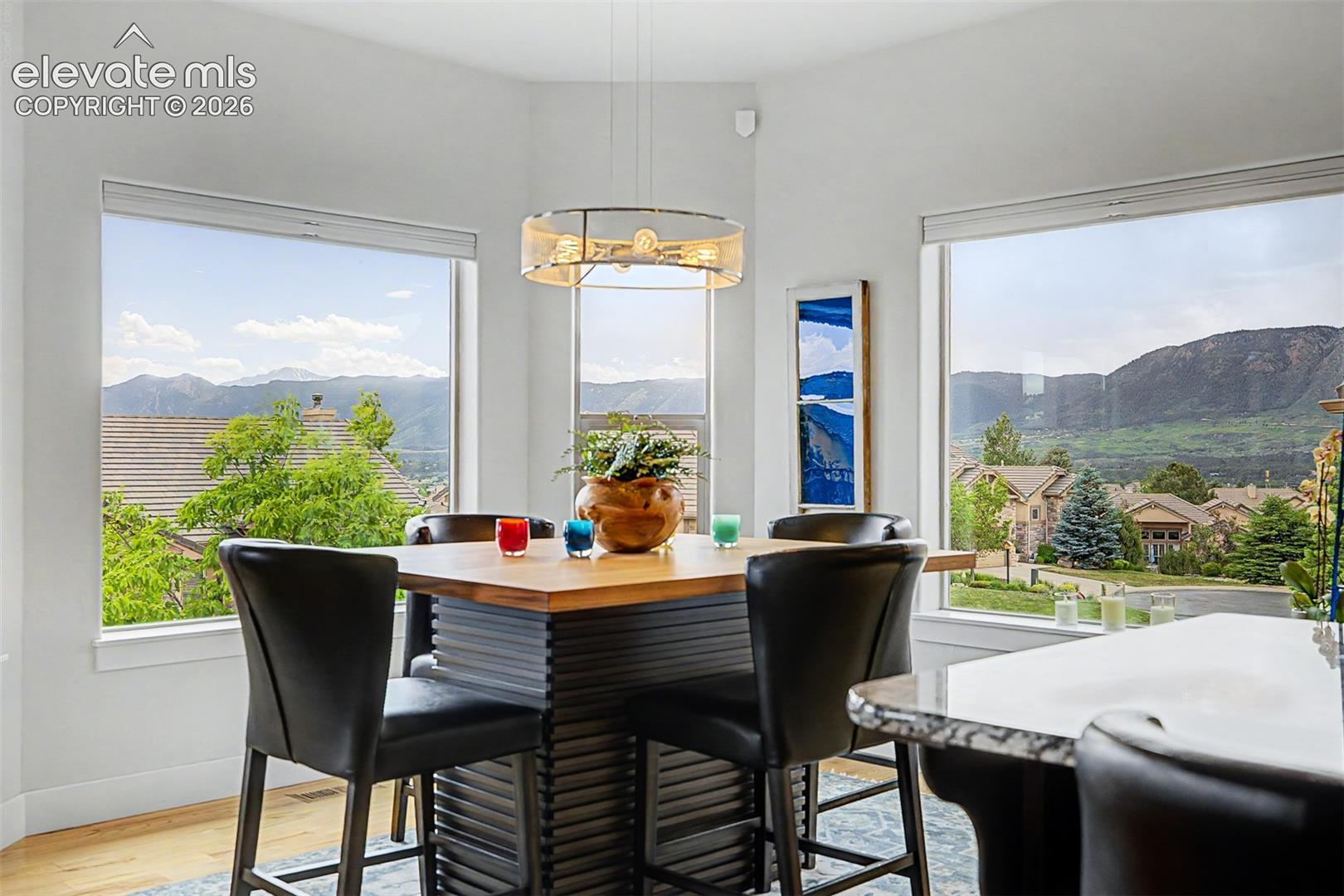 Dining area surrounded by outstanding mountain views, including Pikes Peak!