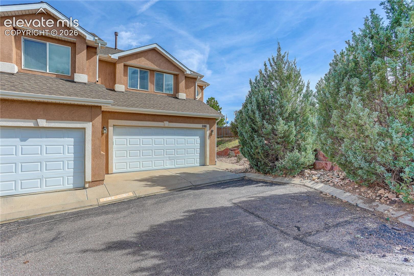 End unit offers private side yard. Entry to garage and front door from Pecan Garden View.