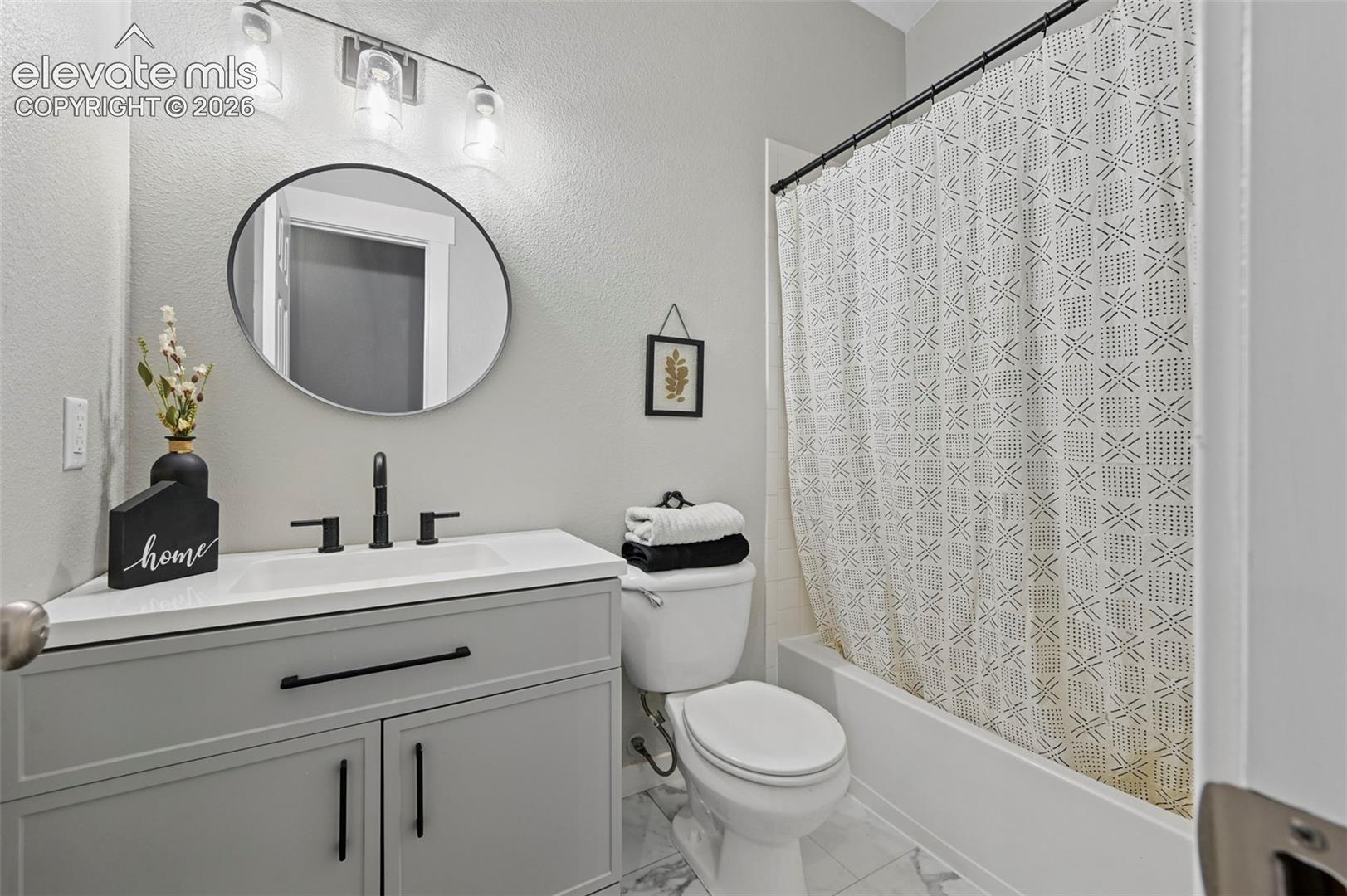 Bathroom with a tub-shower combination