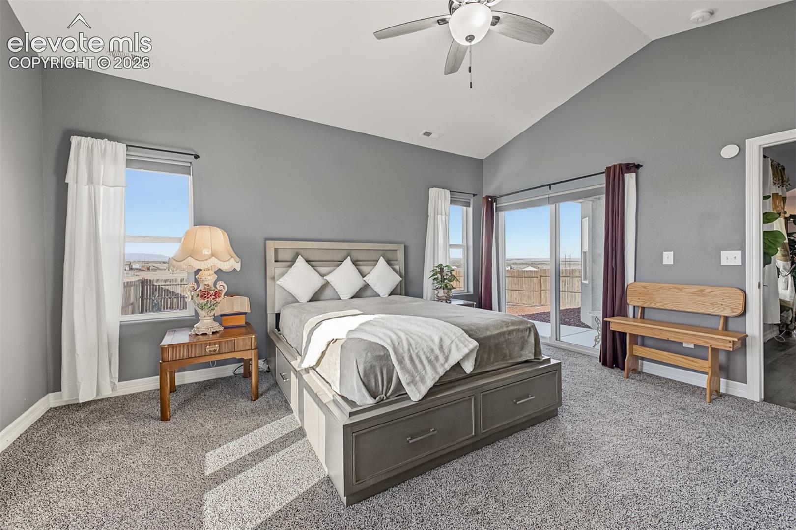 Your primary suite with mountain views, newer carpet, patio access and a spa-like primary bathroom with oversized walk-in closet.