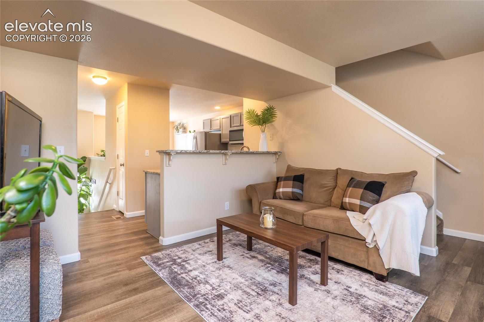 Another view of the main level living room. There is also a convenient main level 1/2 bath.