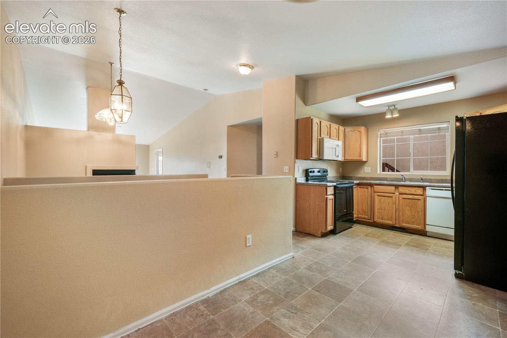 Kitchen eat in area and access to the garage