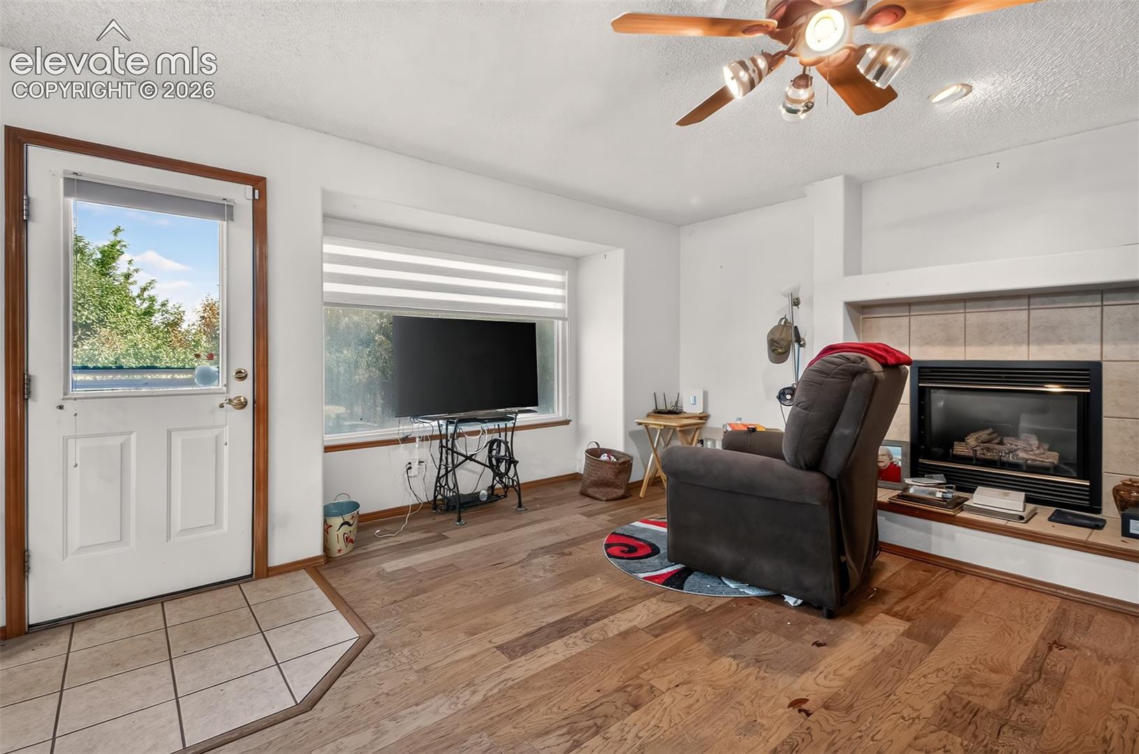 Family Room with Fireplace and walk-out to recntly treated deck