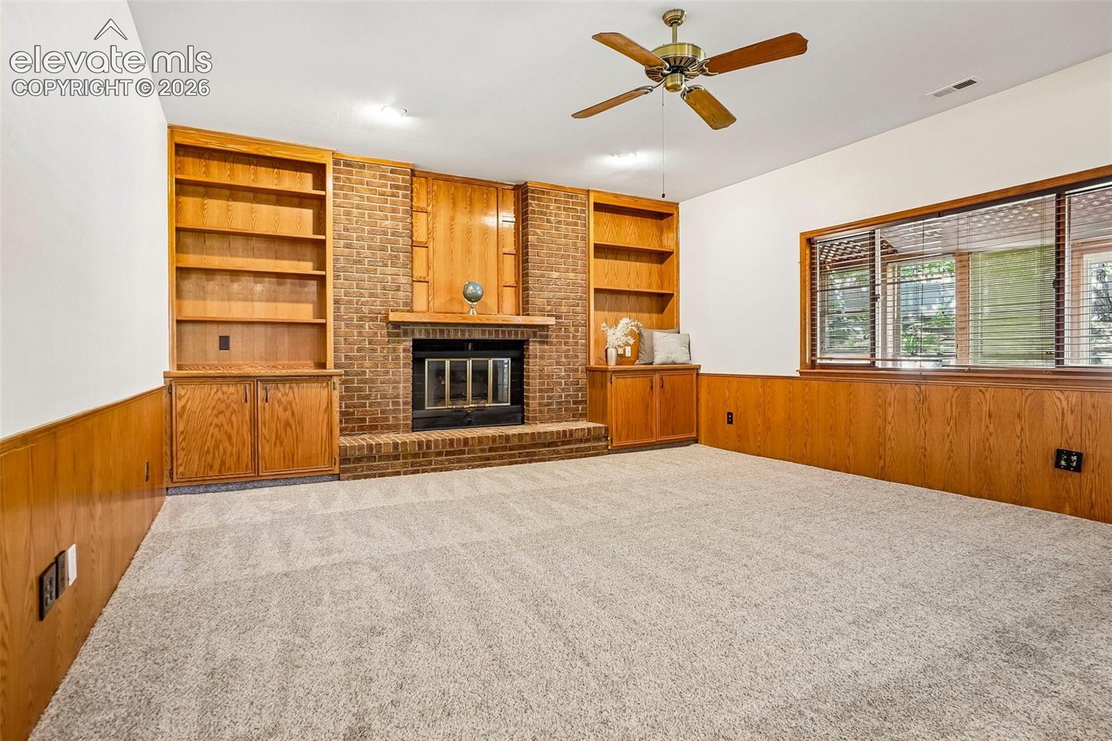 Built-ins and a gas fireplace are the focal points of this large family room.