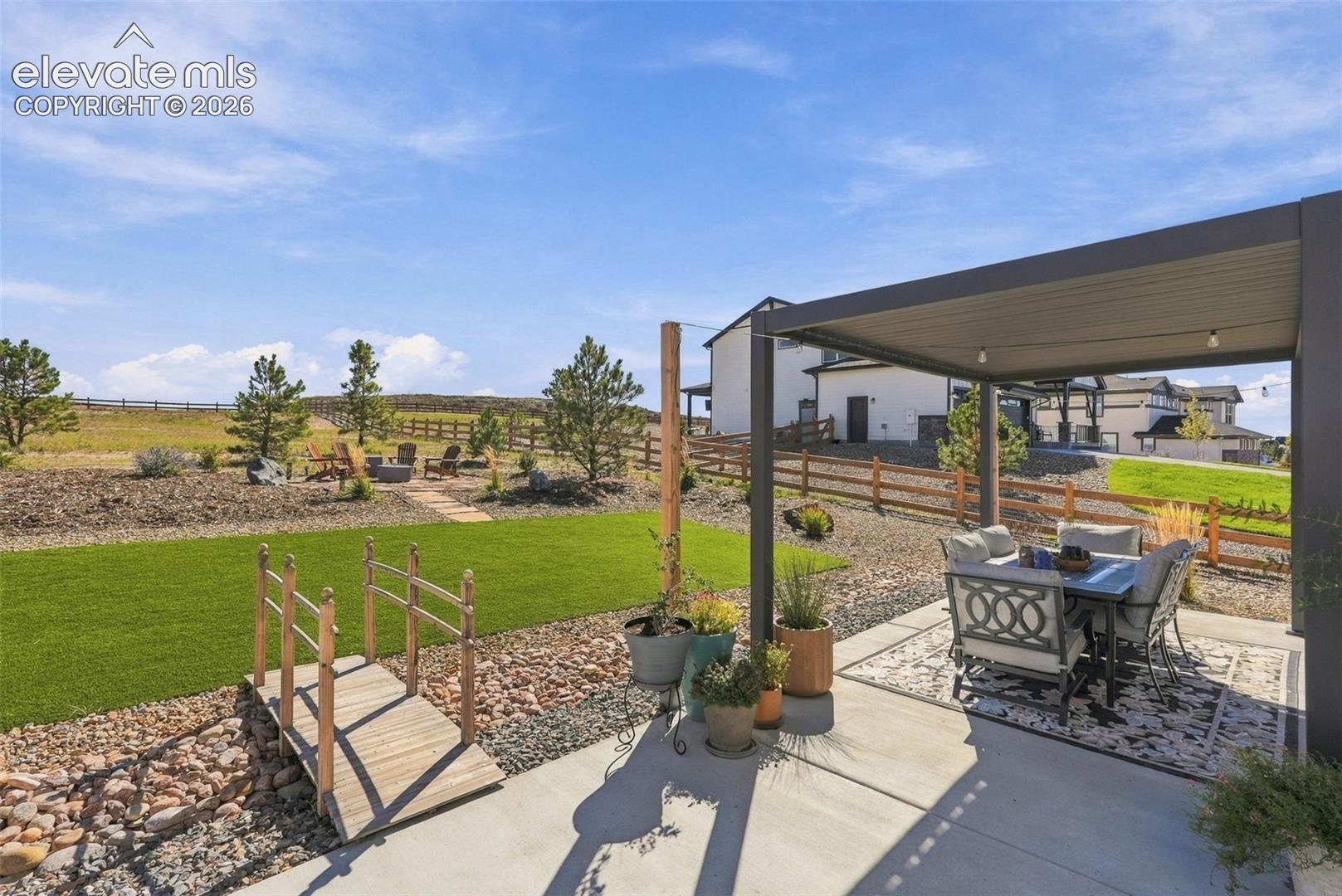 Low maintenance acre with turf area & rock. Remaining acre is naturally grown. 