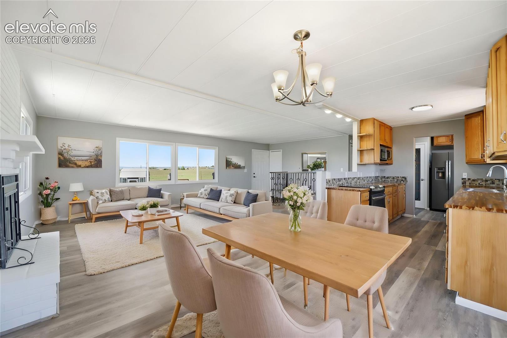 Vinyl Plank, Fireplace, Sliding Door To Deck, Dining Area