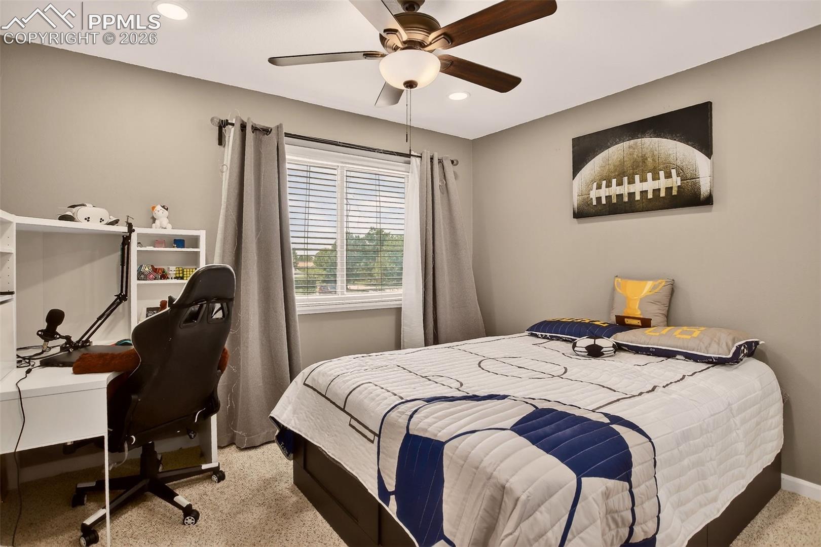 Second bedroom features new paint, new carpet and ceiling fan for added comfort. 