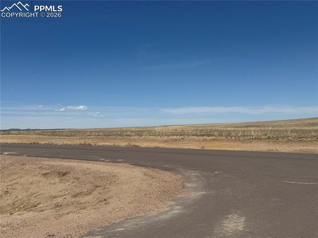 Expansive views of the surrounding natural landscape with a clear, open sky