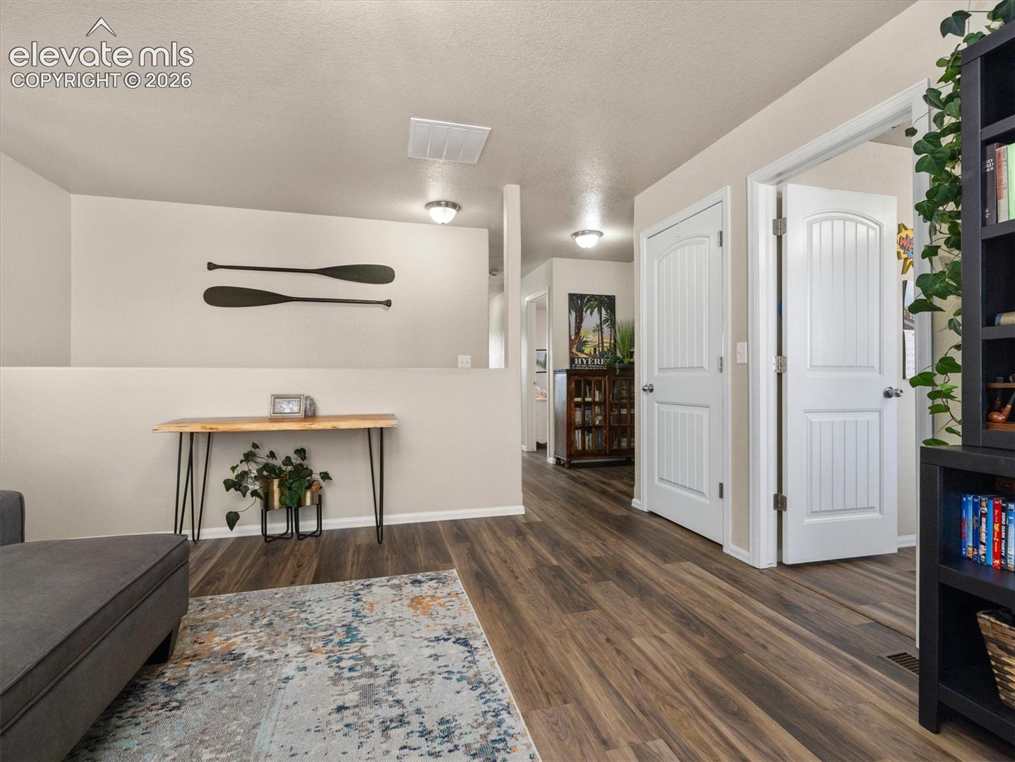 Upper level. LVP flooring throughout, white interior doors, and recessed ceiling lighting