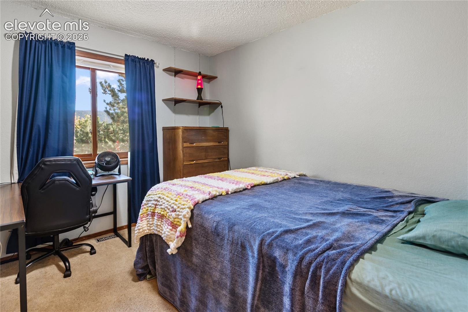 There are 2 additional bedrooms on the main level, 1 of 2