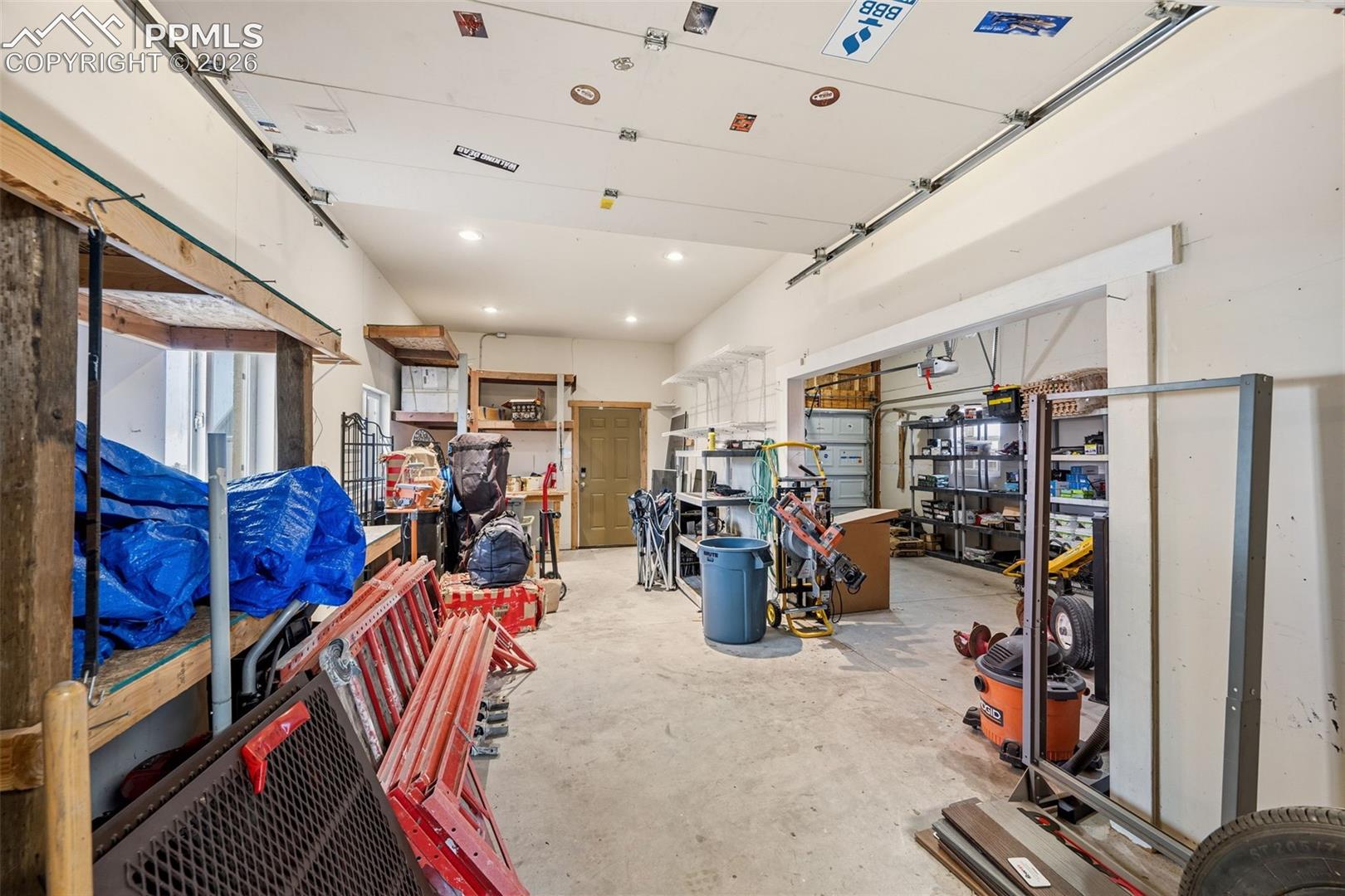 Workshop area opens to garage or storage area