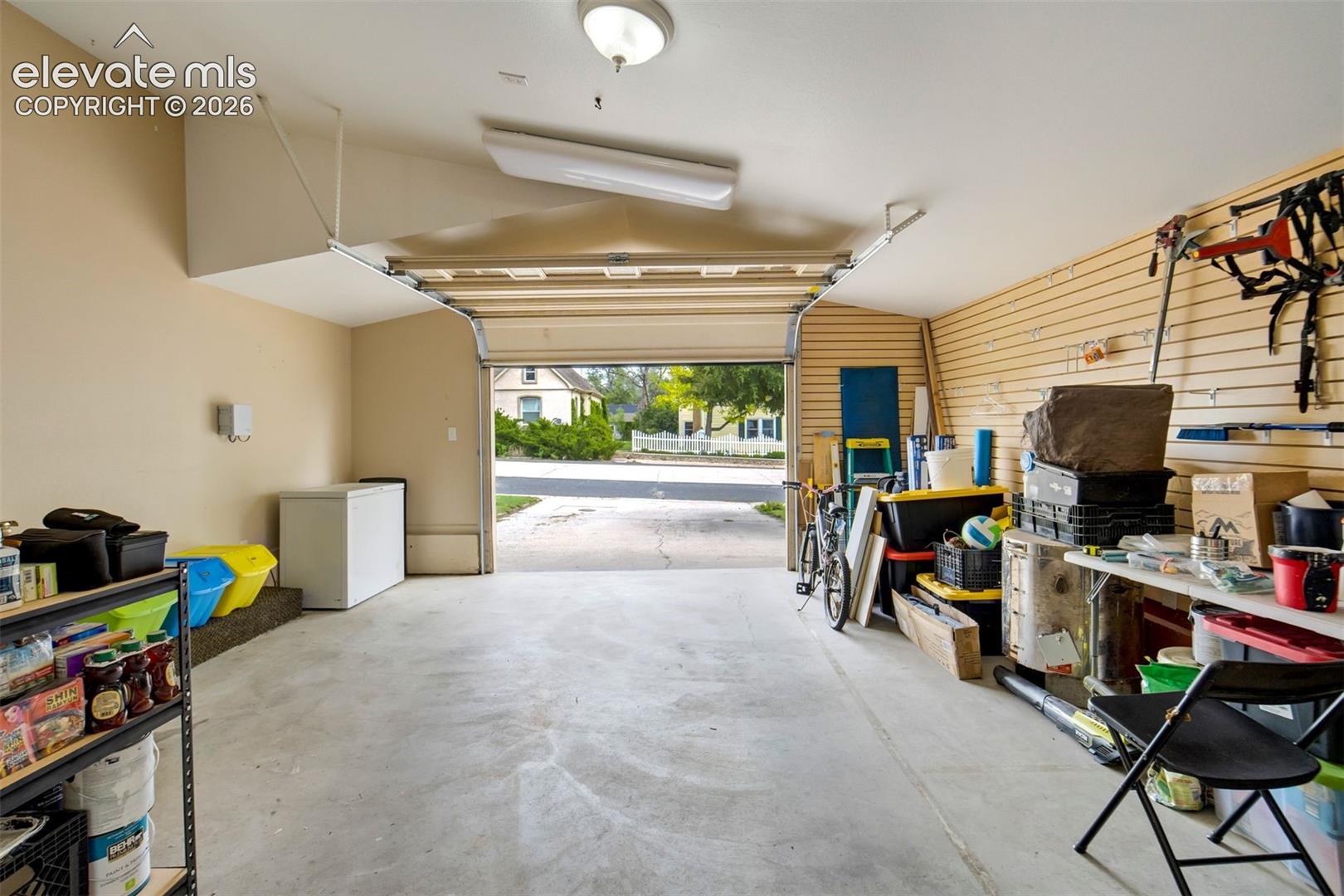 Large garage space provides versatility for parking, storage, home gym, or hobby use.