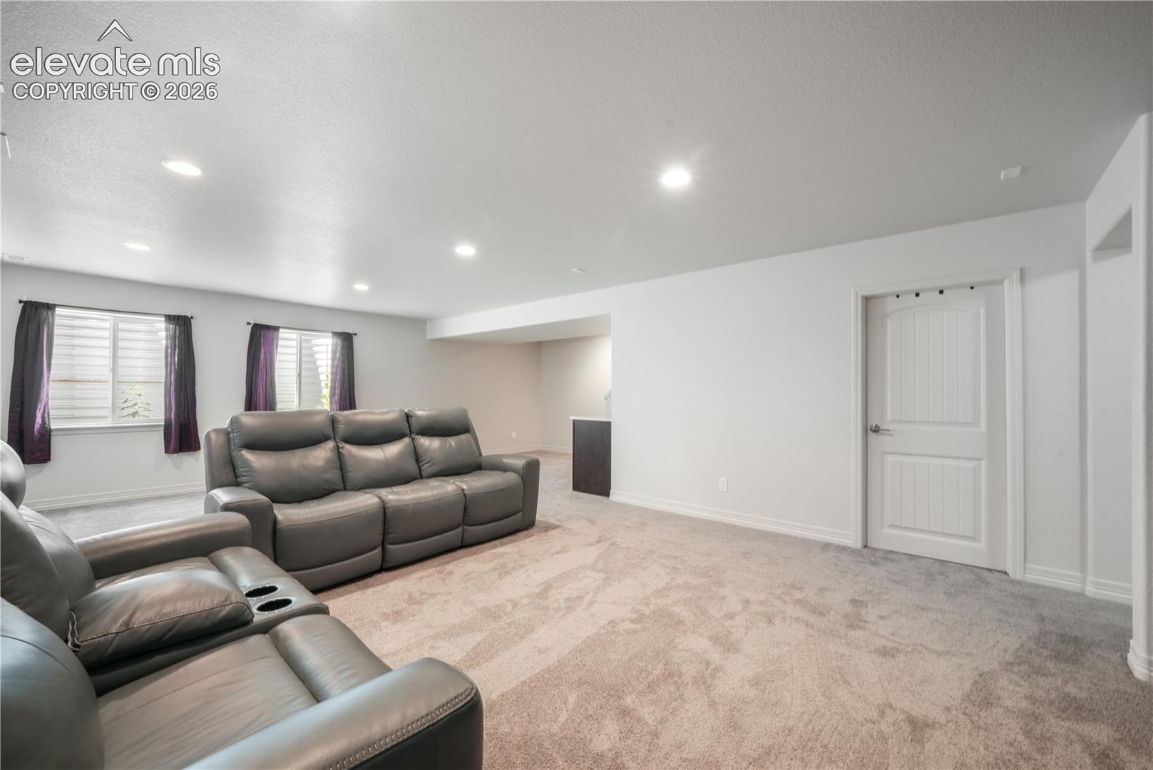 Basement family room with mini wet bar, new carpet