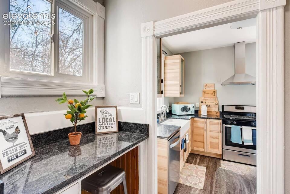 Butler's Pantry between kitchen and living area for additional storage and a small breakfast nook or work desk.
