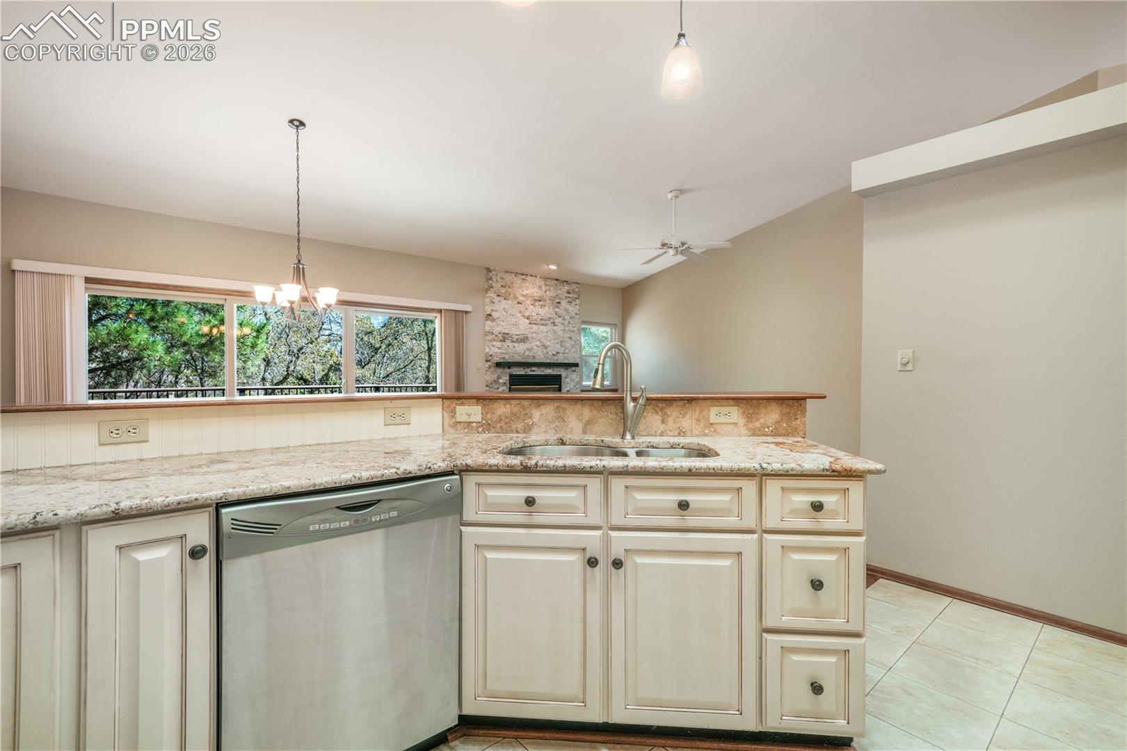 Kitchen with additional bar seating, hard wood floors, updated appliances and granite countertops 