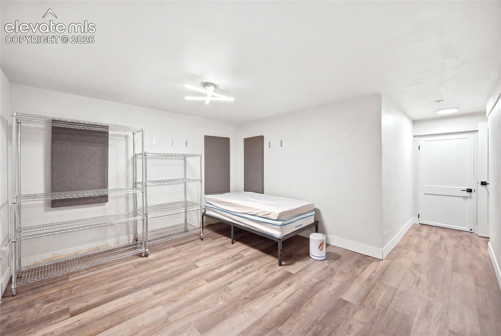 WIth engineered wood flooring and lots of space, this fourth bedroom is a welcome retreat. 