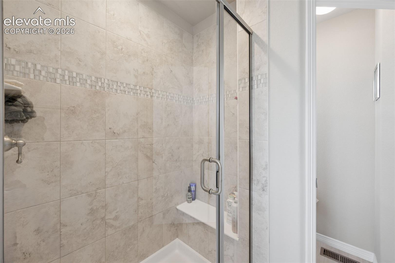 Welcome to this stunning Everest Model built by Saint Aubyn Homes, now Tralon Homes, located in the highly desirable Bradley Ranch community! Offering nearly 3,200 total square feet, this spacious home features 5 bedrooms, 3 bathrooms, a large 3-car garage, and incredible mountain views.The main level showcases an inviting and open layout with a spacious kitchen featuring 42-inch upper cabinets with crown molding, plus a newly installed backsplash that continues onto the kitchen island. The seller has thoughtfully added numerous upgrades throughout the home, making it truly move-in ready. Love to entertain? You’ll appreciate the brand-new enclosed addition and extended back deck, creating even more space to enjoy gatherings or simply take in the beautiful Colorado surroundings. The backyard also features newly installed fencing, a concrete patio, and a sprinkler system. Additional updates and features include: new barn door in the primary bedroom, newly remodeled main-level bathroom, paid-off solar panel system, new radon mitigation system, new front security/storm door, permanent holiday lighting on the front exterior, gutter guards, custom window well covers, custom closet systems in the primary bedroom and two secondary bedrooms, new ceiling fans in two secondary bedrooms, TV mounts installed in all bedrooms, the living room, and basement great room.With mountain views, extensive seller upgrades, abundant living space, and a fantastic location close to schools and shopping, this Bradley Ranch home offers the space, features, and lifestyle you've been looking for. Don't miss the opportunity to make this exceptional home yours!