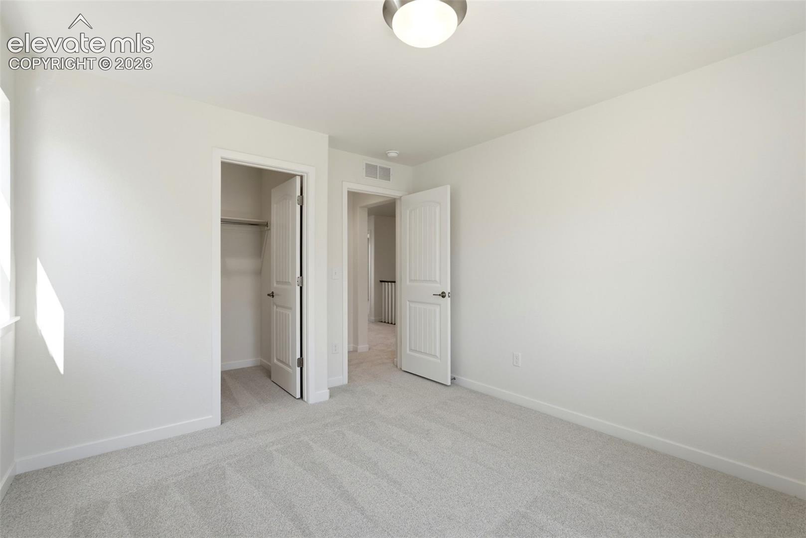 Bedroom 2 located on the upper level