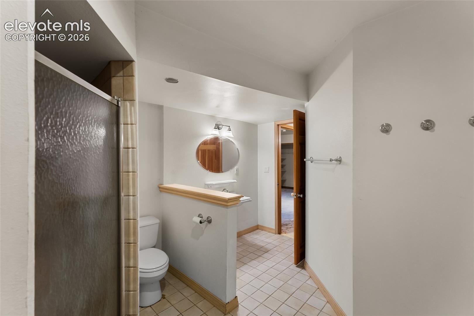 Tiled flooring with a partial wall separation