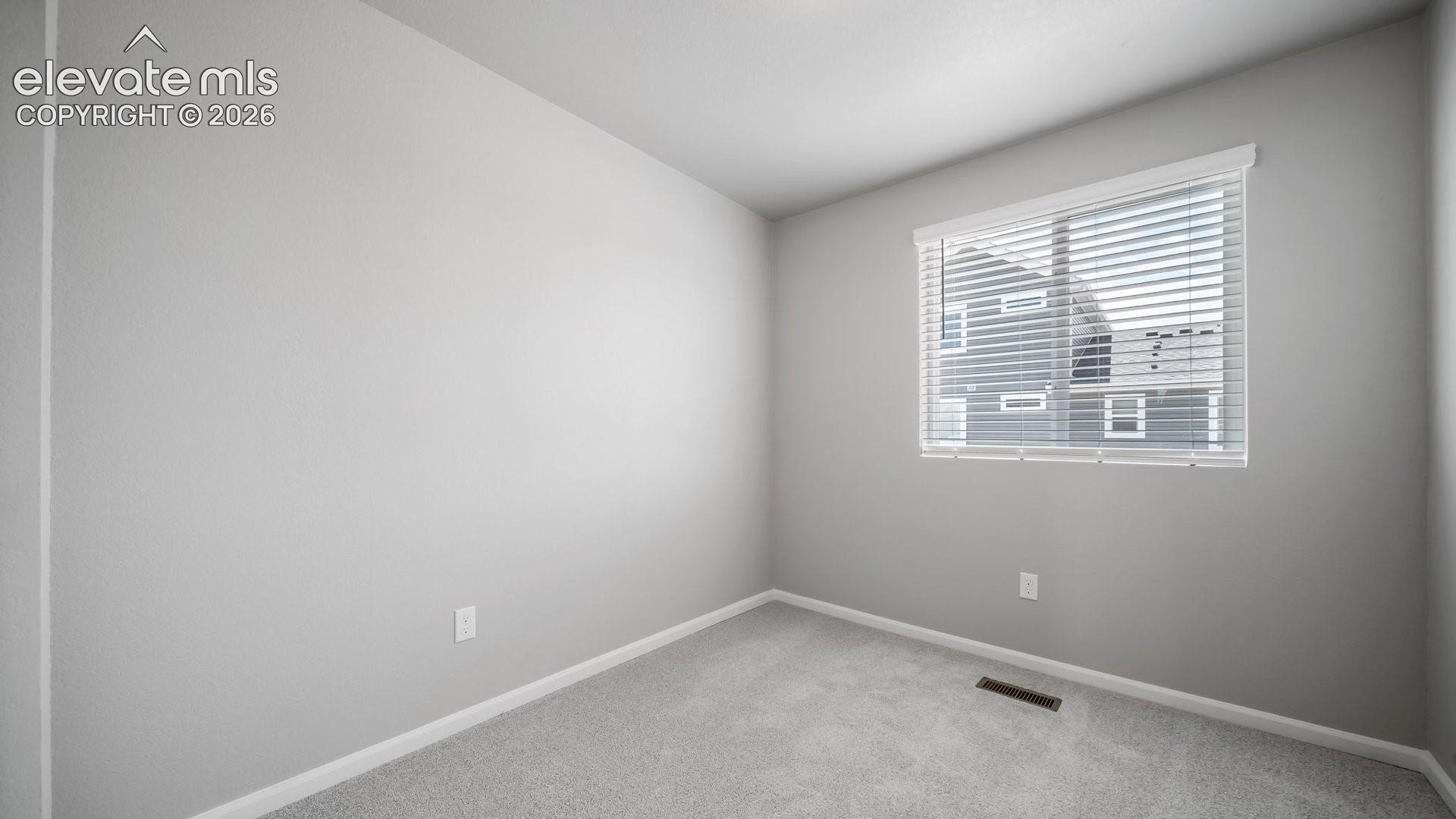 Neutral wall finish, wall-to-wall carpeting, and horizontal slat window blinds
*photos of a model home*