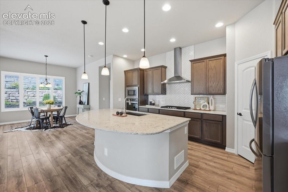 Huge kitchen with granite counters and stainless steel hood!  Gas stove!