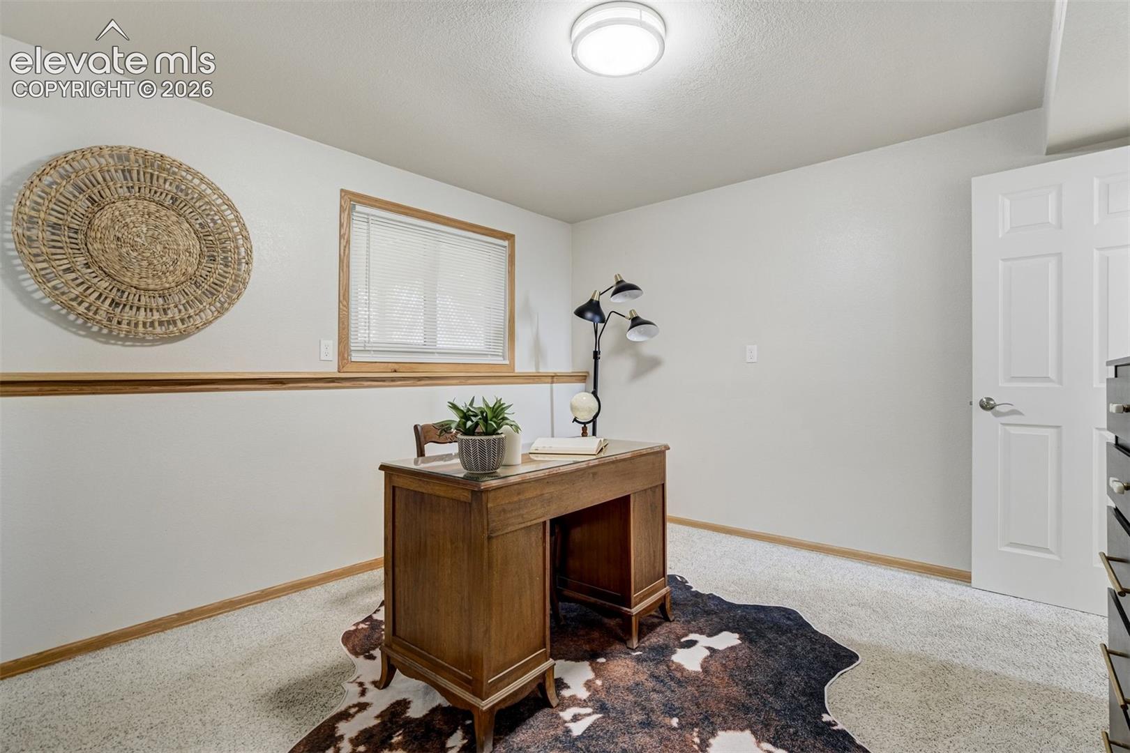 The 4th bedroom in the lower level currently used as an office. 