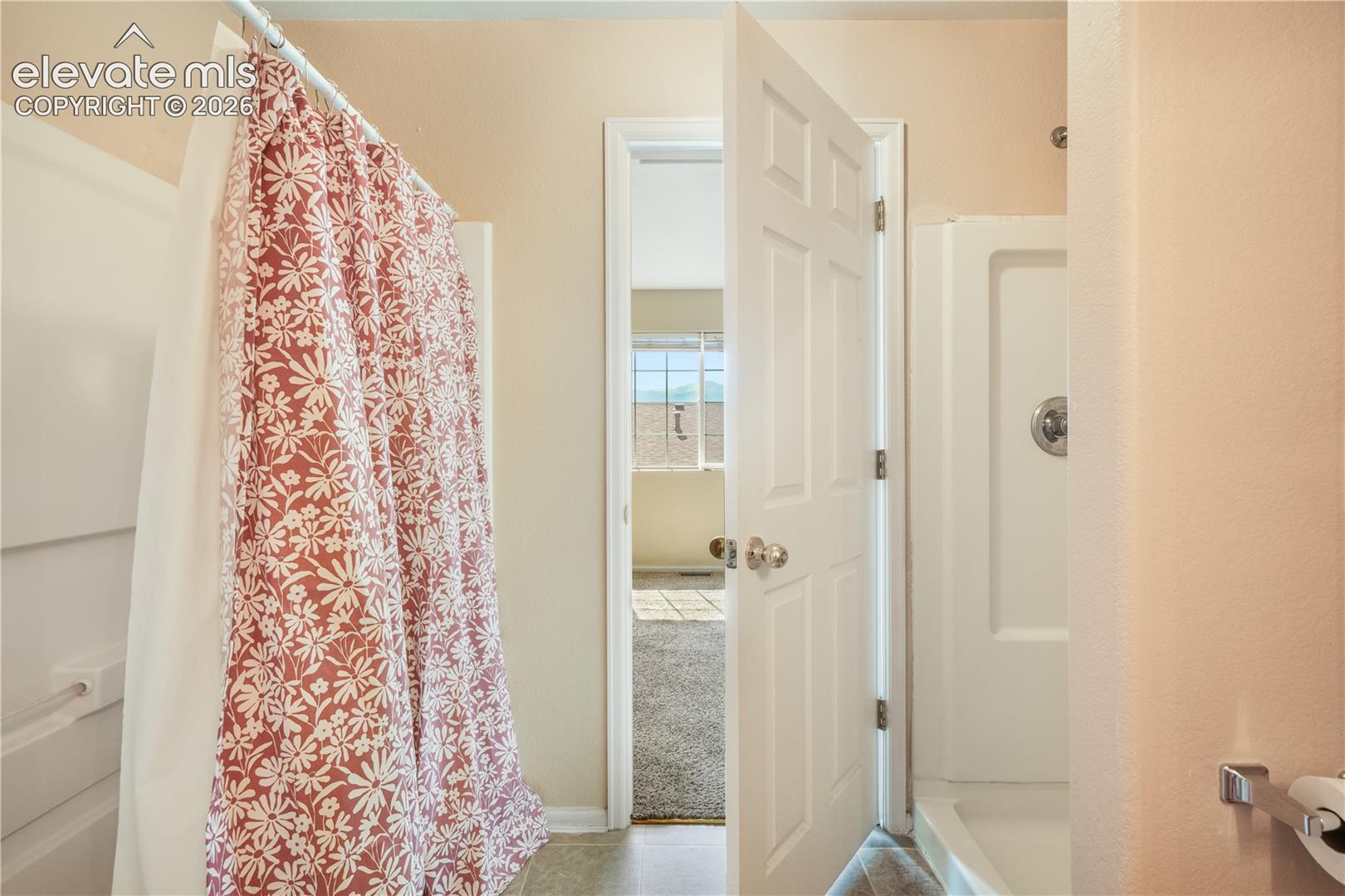 Main level primary ensuite bathroom 2 vanities, 2 separate showers
