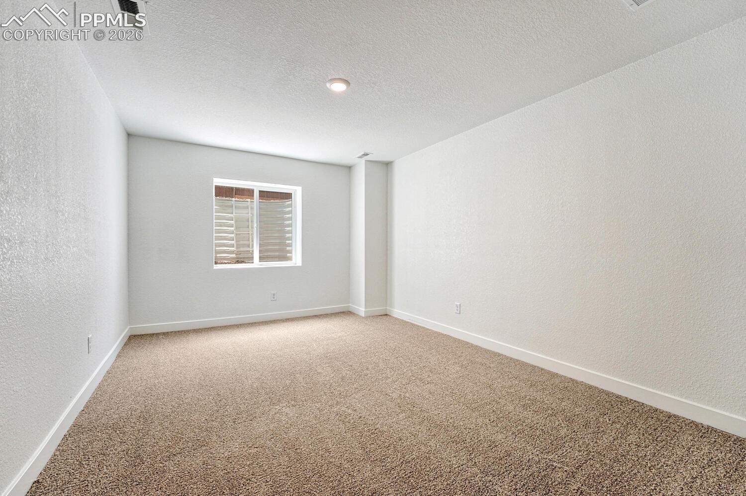 Fourth bedroom in the basement is perfect for guests or generational living.