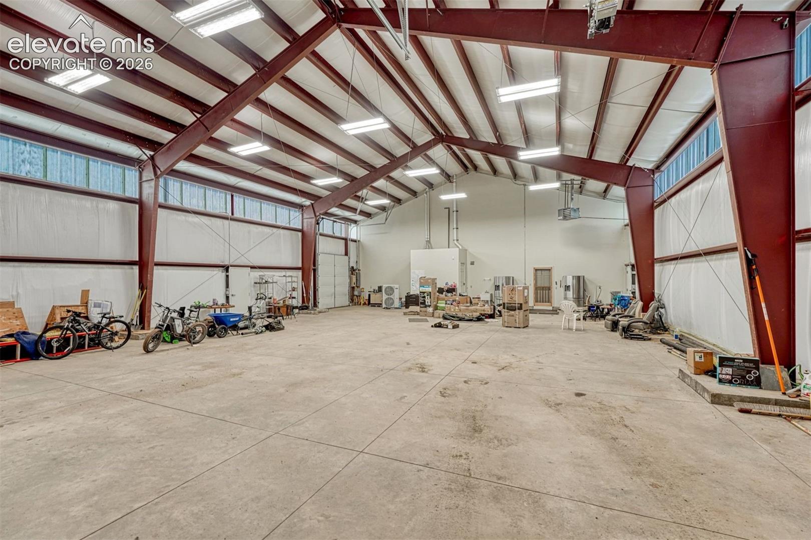 With overhead RV door plus 9' overhead door - heated and insulated.