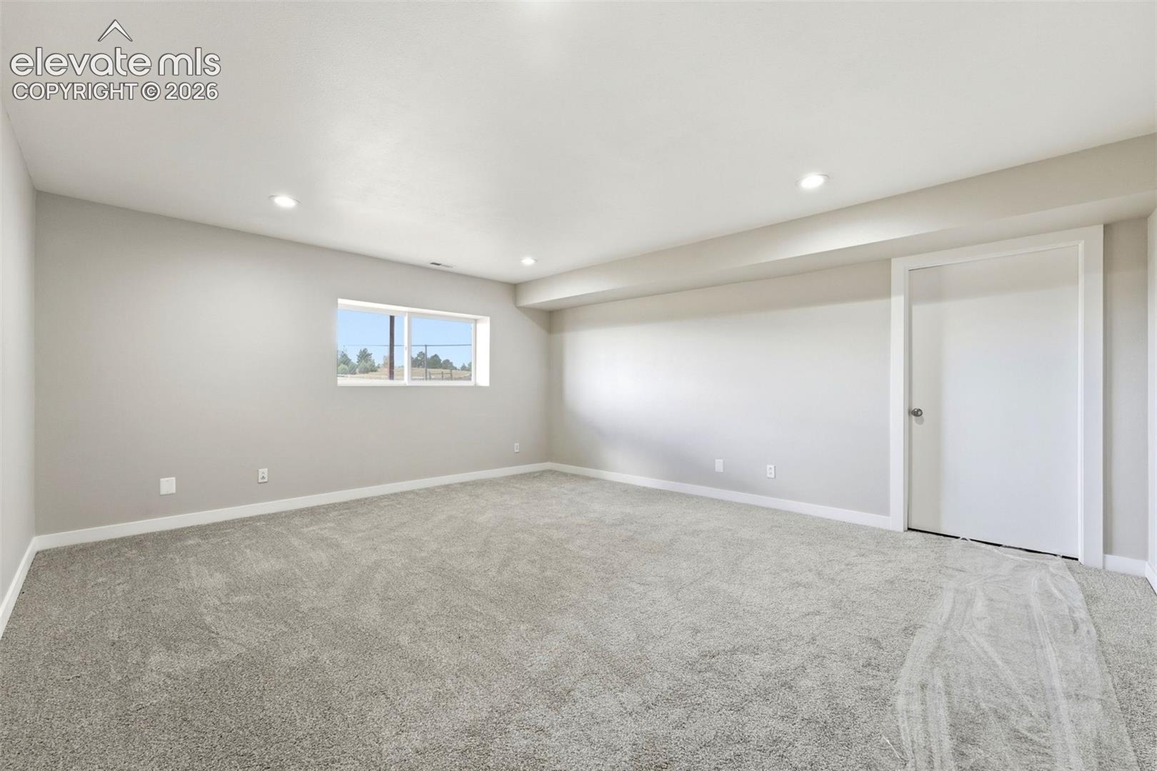 Neutral wall tones and recessed lighting