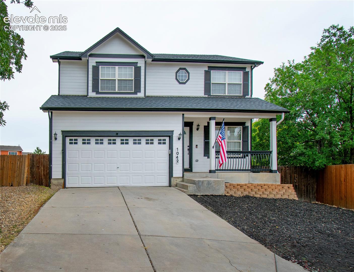 Upon entry, you are greeted by a generously sized living room with plenty of natural light. The living room flows into the dining area, which features a gas fireplace and a walkout to the back deck and spacious, fully fenced backyard. The kitchen offers stainless steel appliances, a pantry, and plenty of cabinet space. The main level also features a powder bath and convenient laundry room. Upstairs, you will find three secondary bedrooms with easy access to a full bathroom featuring a tub/shower combination. The primary bedroom adjoins a five-piece bath and offers a large walk-in closet. The basement provides additional living space with a family room, an additional bedroom, and a full bathroom. Conveniently located just minutes from Fort Carson, nearby schools, shopping, and everyday amenities, this home offers a functional layout with plenty of space both inside and out.