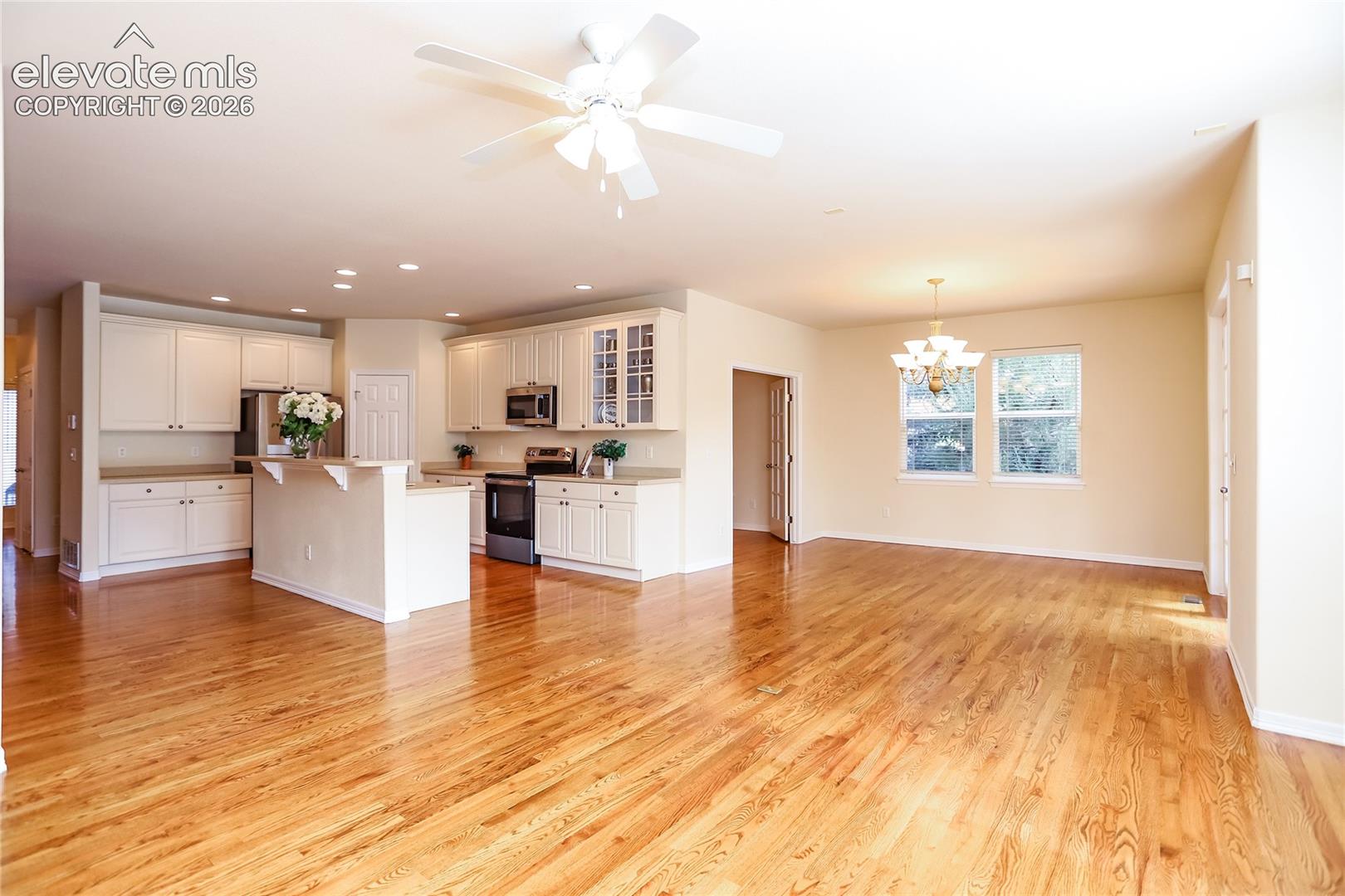 This view from the family room showcases the open floor plan. You can see the dining area and the french doors to the office.