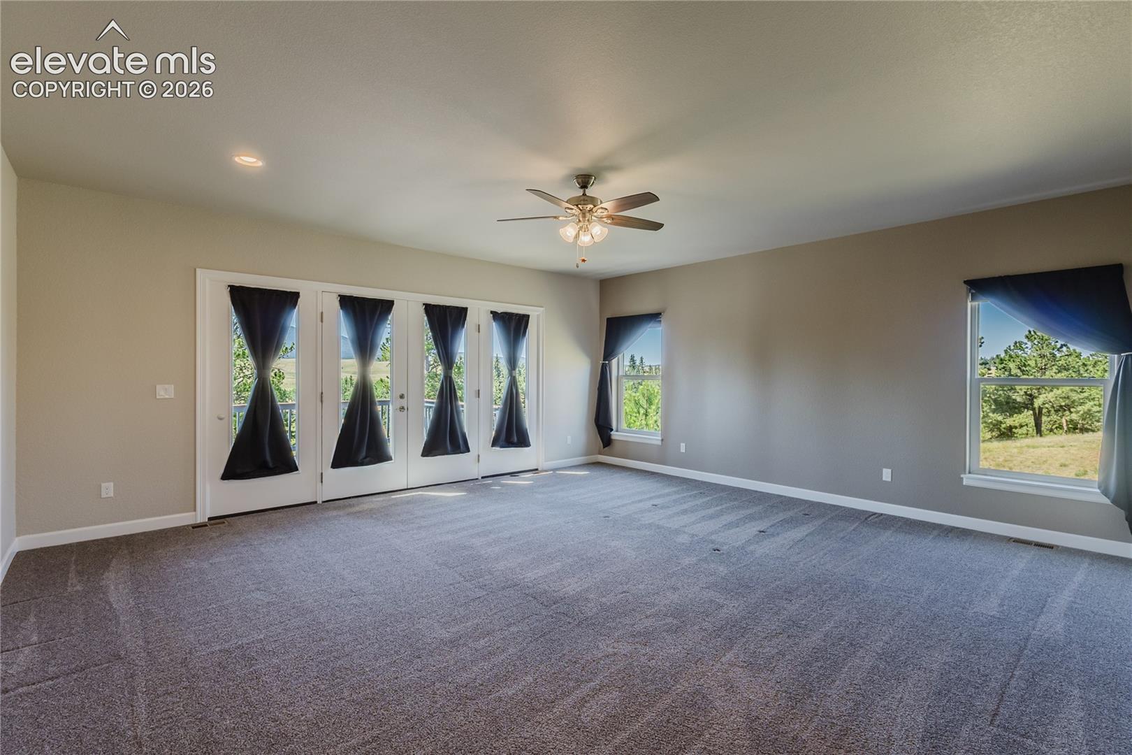 Giant primary bedroom with walk out to deck. 