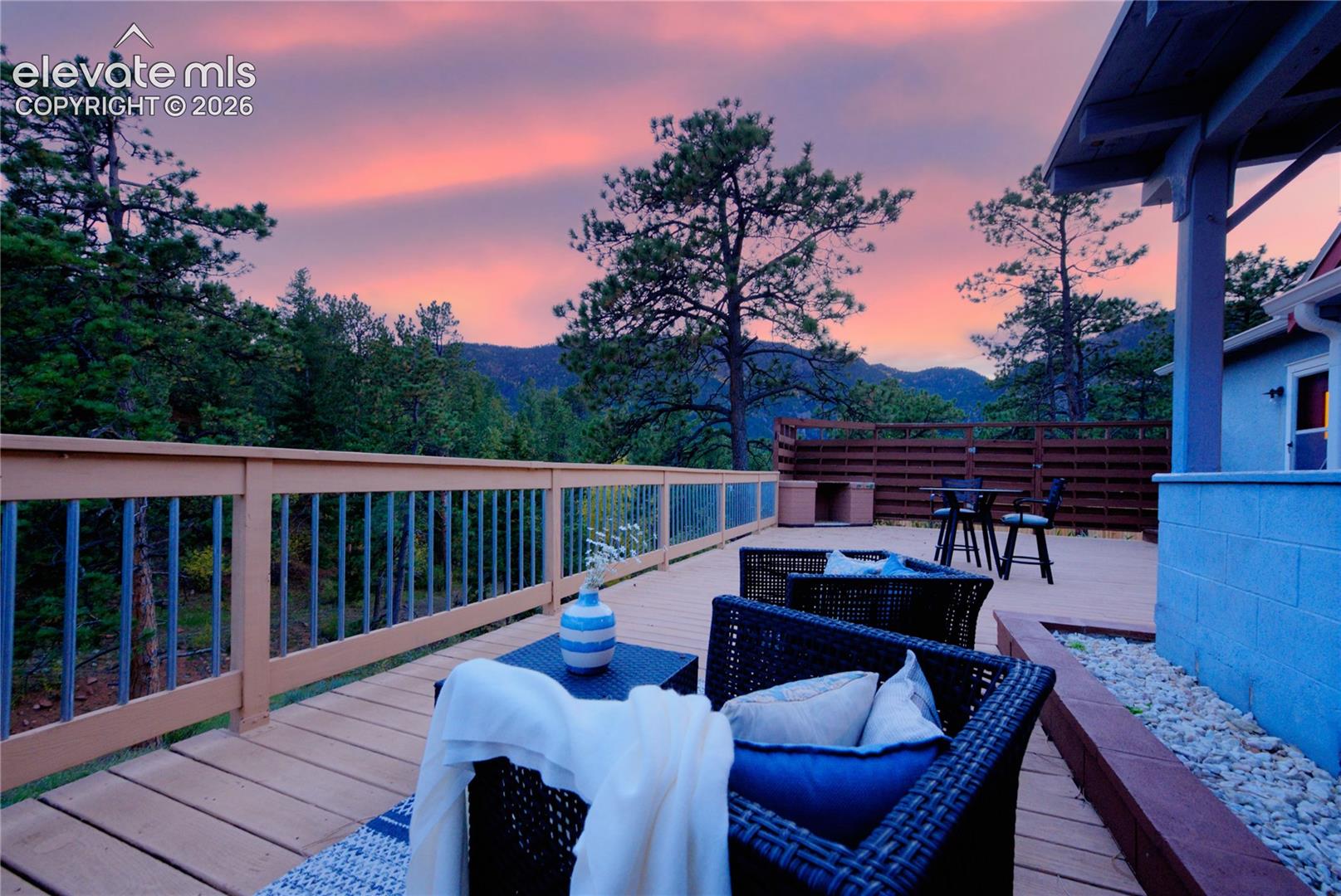 Alternate view showcasing the Deck's comfortable seating area and peaceful outdoor setting.