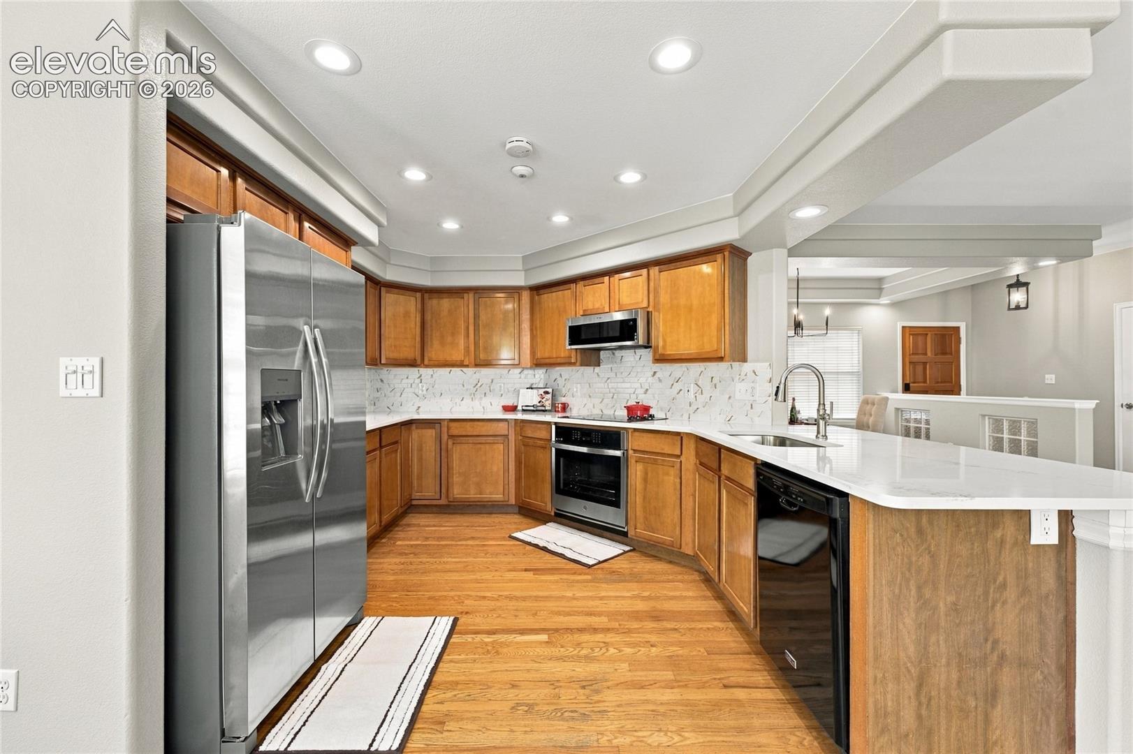 spacious kitchen with new counter tops and new backsplach