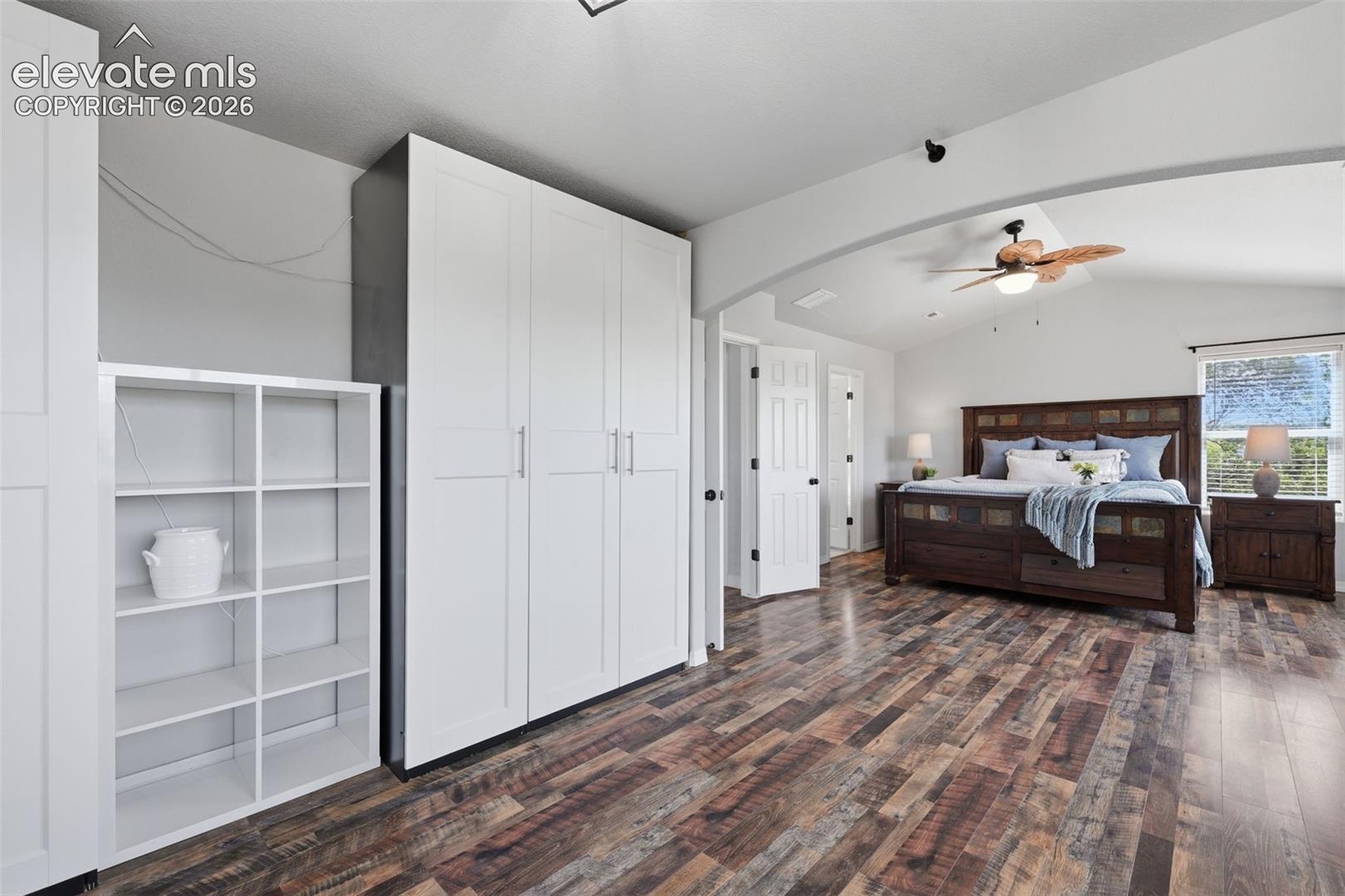 Another view of the master suite with plank flooring and double doors!