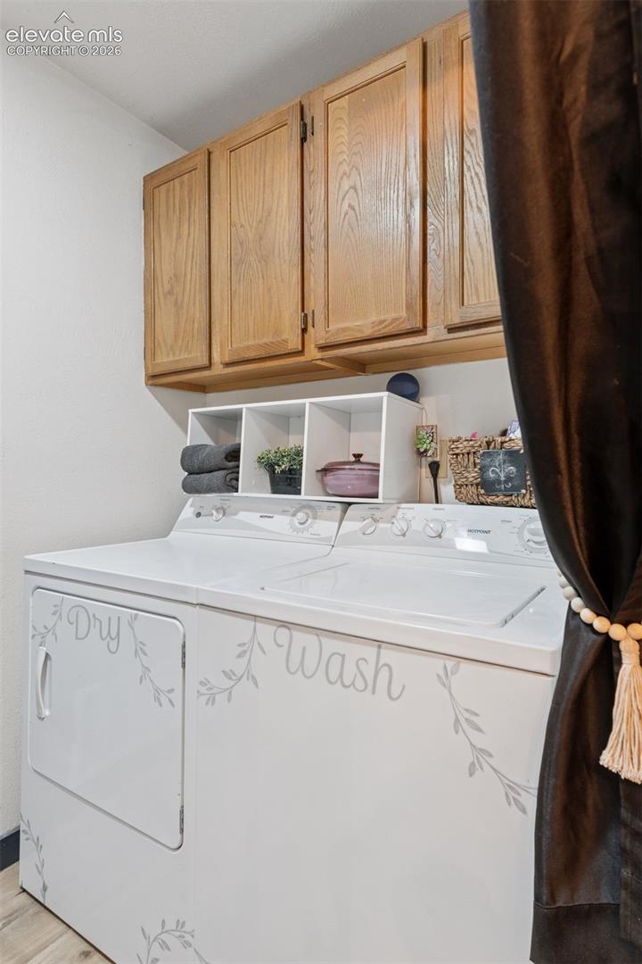 Laundry room with cabinets for storage