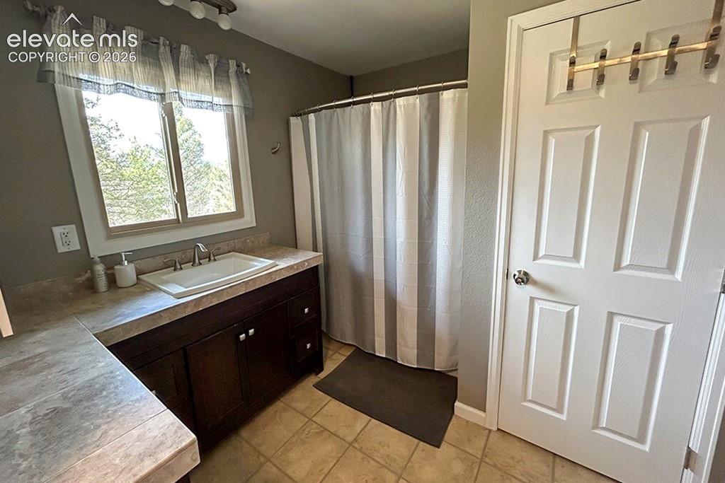 Full, oversized, main floor bathroom. Attached to large main floor bedroom