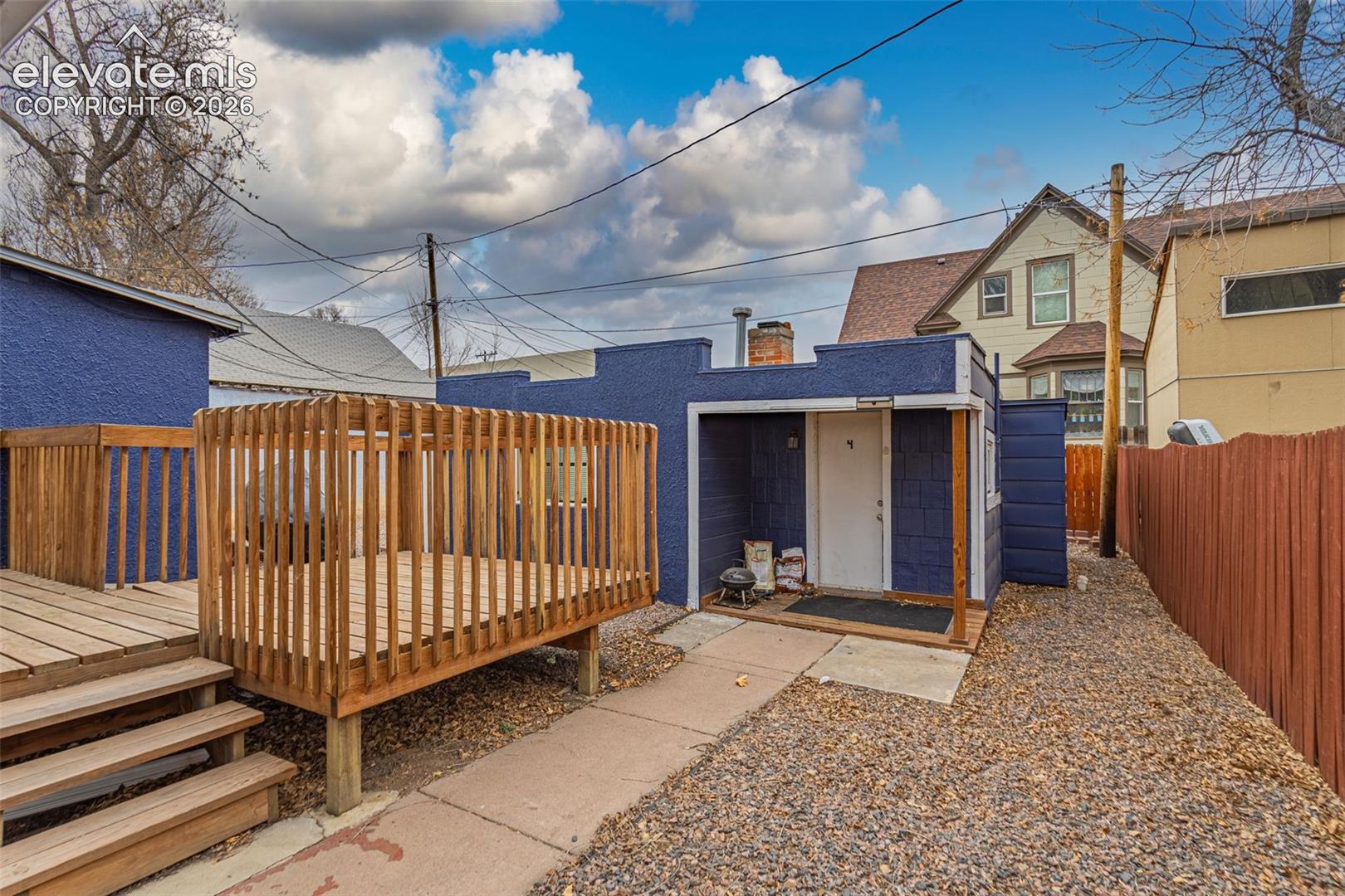 Back of property with a deck