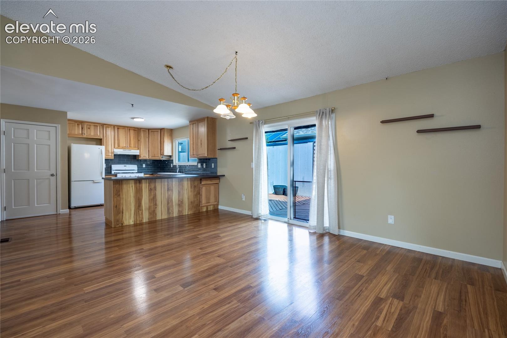 Wood-finish flooring throughout the space