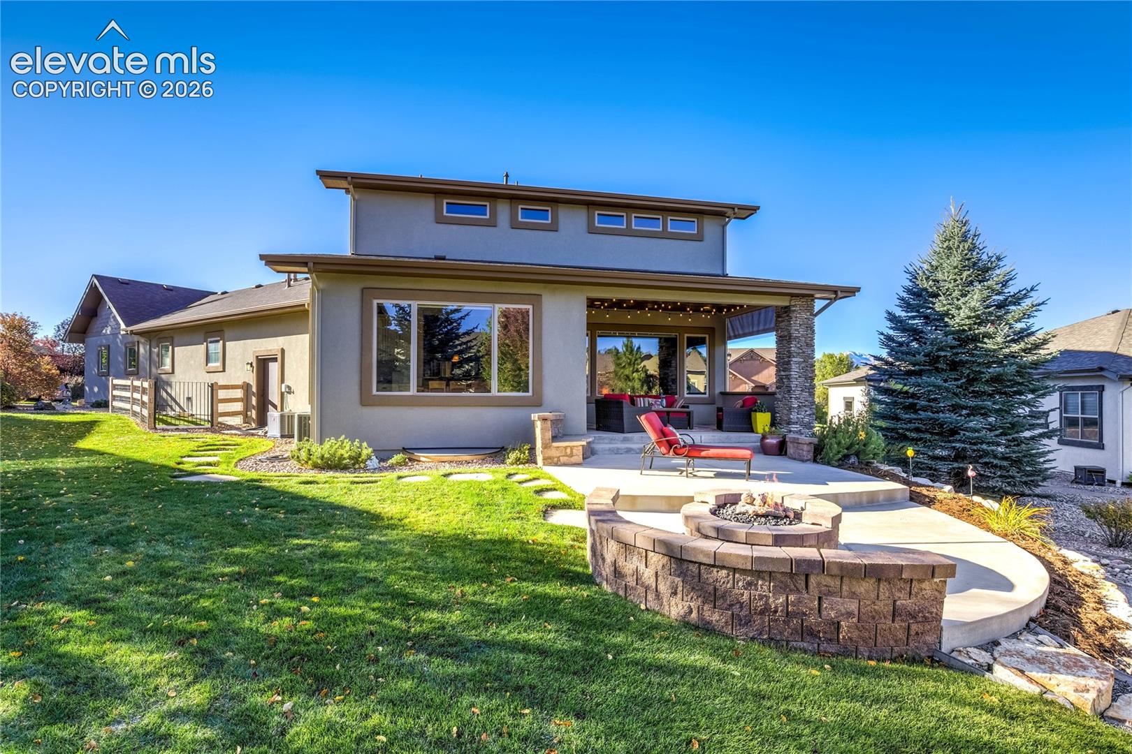 Custom architecture, expansive windows + covered outdoor living spaces overlook the beautifully landscaped 0.32-acre homesite, complete with mature trees, a dedicated dog run + invisible fence.