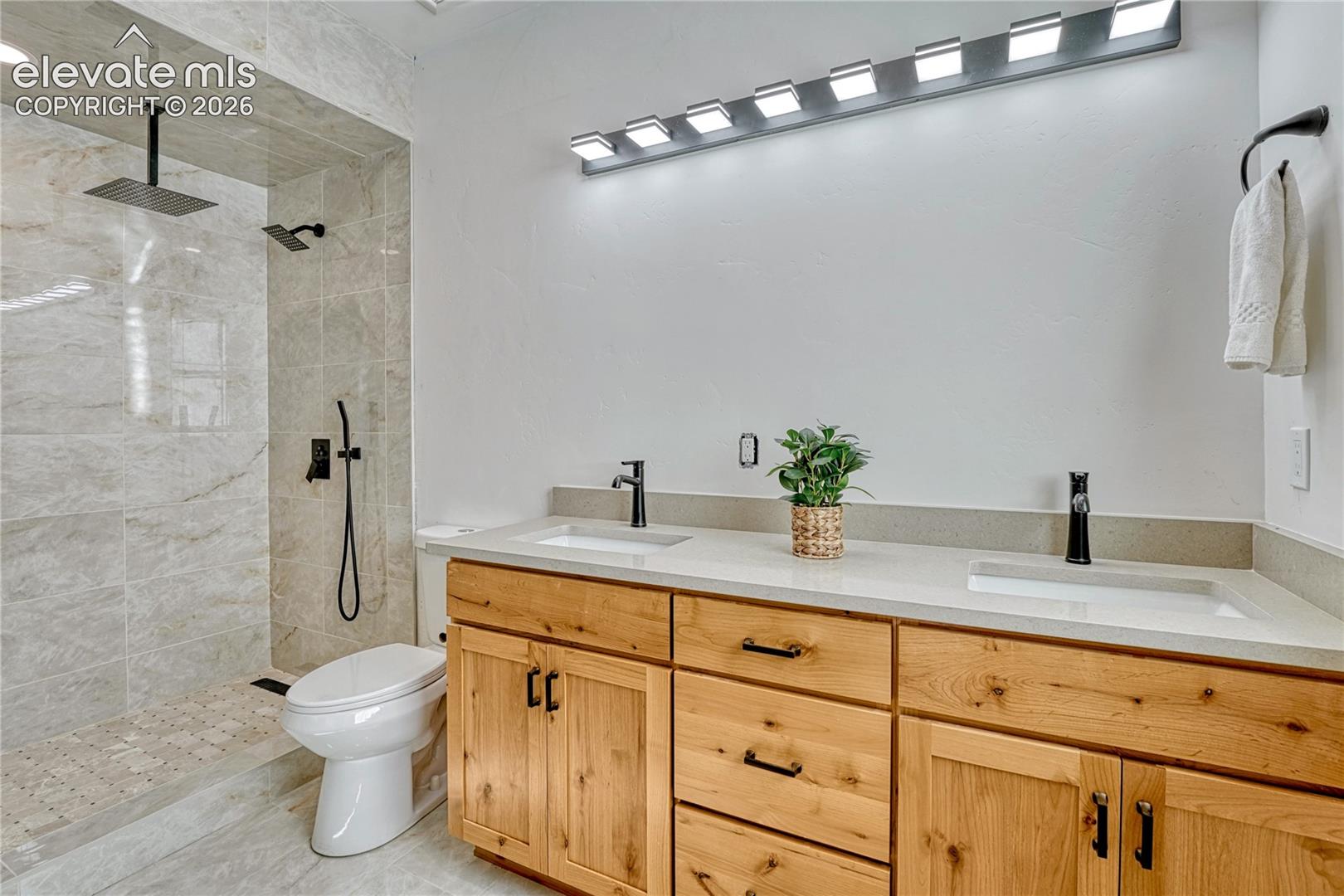 Primary shower. Mirror is being installed.