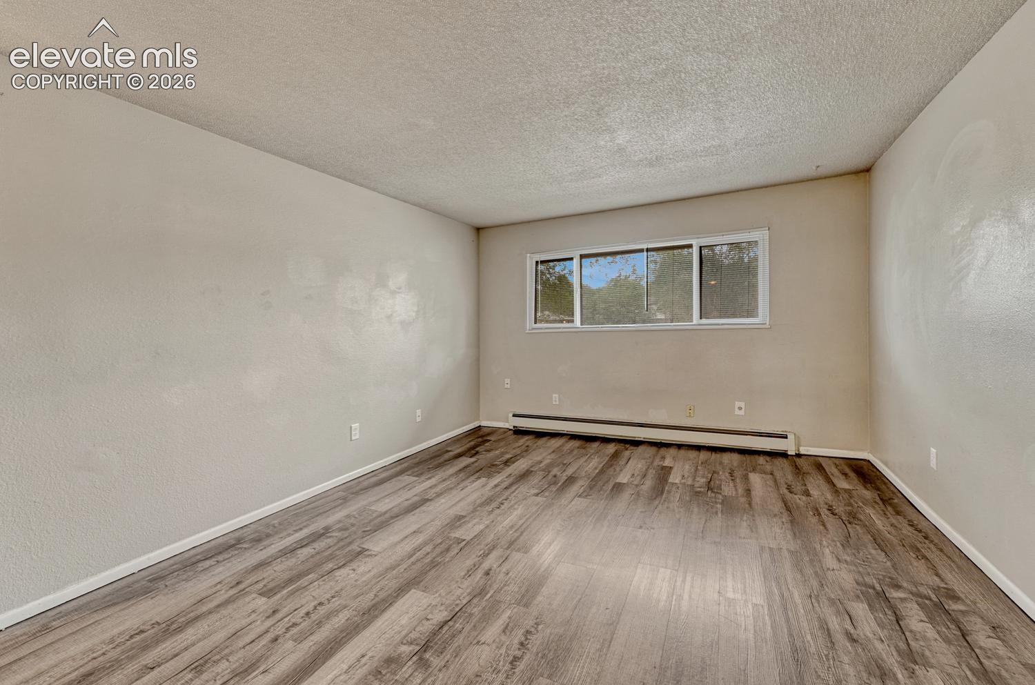 Wood-finish flooring with baseboard heating