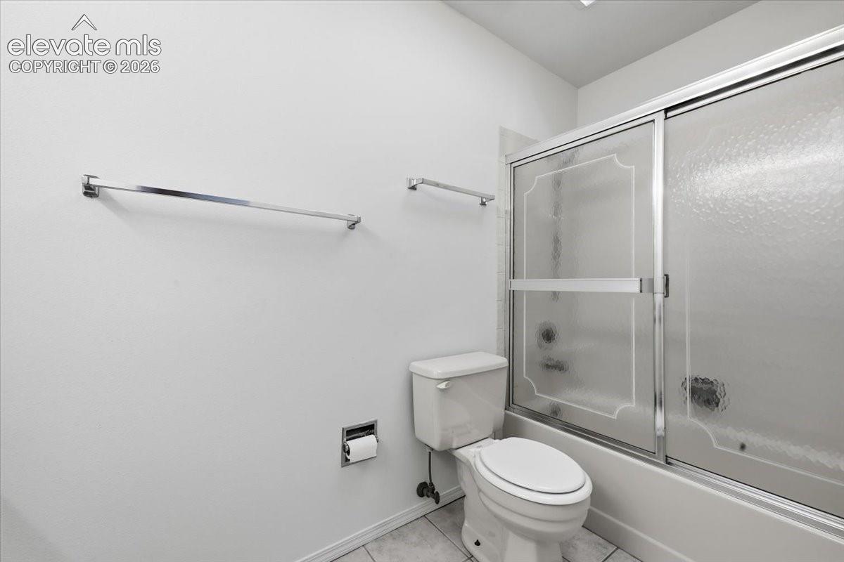 Primary ensuite bath with a tub-shower combo at , Colorado Springs, CO.