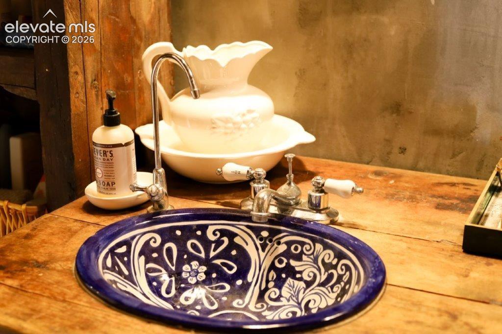 Blue-and-white patterned basin sink set into a wood-finish countertop